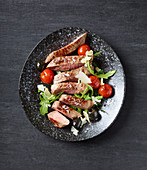 Tagliata with rocket and cherry tomatoes