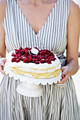 Woman holding cherry cake