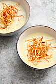 Cream of root vegetable soup with fried grated celeriac