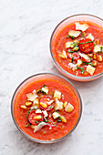 Fruity watermelon and tomato soup with pine nuts