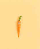 A peeled carrot with eyes