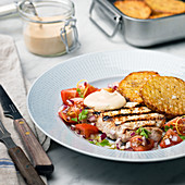 Grilled chicken and cherry tomatoes on plate