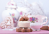 White chocolate candy, gingerbread cookies, cup of coffee