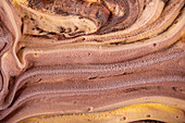 Texture of orange fruit and chocolate ice cream