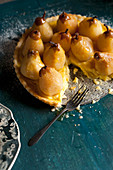 Roasted Pear and custard tart with piece missing