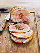 Roast saddle of lamb with pancetta stuffing