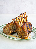 Roasted rack of lamb on a platter