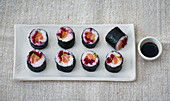 Maki sushi with salmon and beetroot