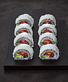 Rainbow inside-out rolls with salmon