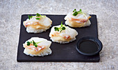 Nigiri sushi with cod and radish