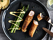 Cordon bleu sticks with asparagus and hollandaise sauce