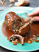 Spanish roulade filled with olives, almonds and peppers