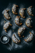 Almond Croissants in a dark background