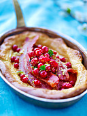 Pancake with lingonberries and bacon