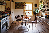 Fifties-style breakfast table and two chairs in kitchen