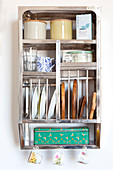 Vintage accessories on stainless steel kitchen shelving