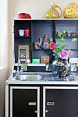 Black case kitchen with colourful accessories