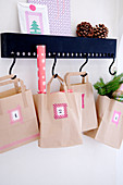 Numbered paper bags covered with washi tape as an advent calendar