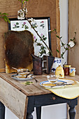 Nostalgically laid table with honey, honeycombs, and branches