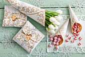 Decoratively wrapped gifts lace bags made from paper doilies
