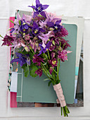 Different columbines in pink, violet, and lilac as a bouquet