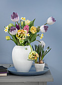 Tulips, hyacinths, daffodils, and grape hyacinths in a vase