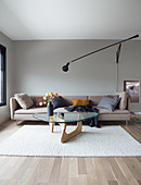 A light upholstered sofa and a coffee table on a natural white carpet