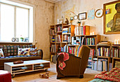 A bookcase made of wooden boxes in a vintage-style living room