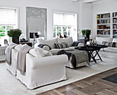 White slip covered furniture, ottoman and coffee table in the living room