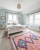 Pretty bedroom with pale blue walls