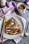 Chocolate crepes filled with coconut cream, served with a cup of coffee