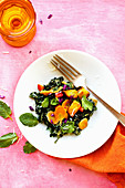 Fried potato salad with kale, carrots, mint and coriander
