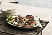 Grilled fish and vegetables on a serving platter