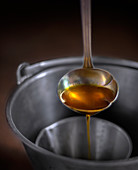 Rapeseed oil in a ladle