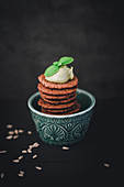 A stack of spiced biscuits in a bowl