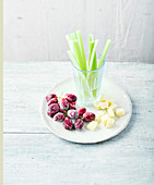 Frozen grapes with cheese and celery sticks