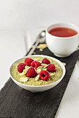 Matcha porridge with raspberries