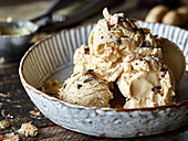 Peanut butter ice cream with pieces of chocolate
