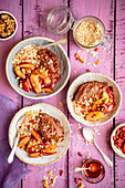 Sweet potatoes and chocolate cream with muesli and plums