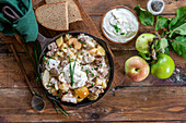 Apple pork stew with potatoes and sour cream