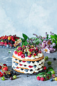 Honey layer cake with cream cheese and berries