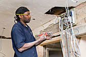 Electrician installing cables