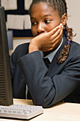 Secondary school student concentrating in an ICT lesson