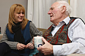 Elderly man with carer