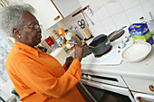 Elderly woman in kitchen