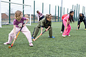 Group of children practicing hockey