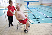 Disabled man leaving a swimming pool