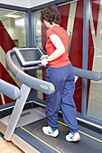 Woman using a treadmill