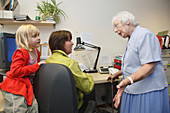 Woman trying to work being disturbed by family members