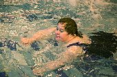 Woman with learning disability in swimming pool